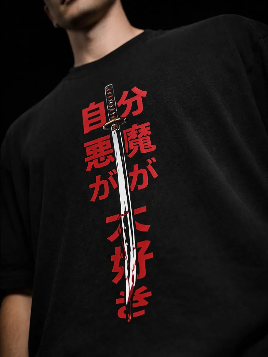 Model wearing Oni Reaper oversized black streetwear t shirt